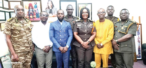 Robert Kwabena Ayitey (3rd from left), MD, BH-FERTAGRO,   Patience Baffoe-Bonnie (3rd from right), Director-General of Prisons, and other officials at the meeting
