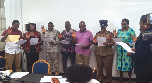 Members of the Central Regional Disaster Management Committee being sworn into office