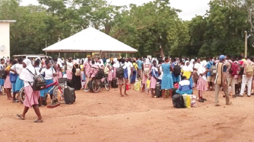 Students waiting for government evacuation teams to transport them out of the conflict zone