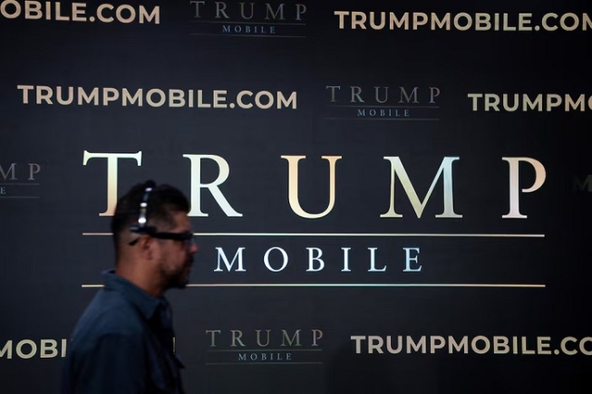 A person walks in front of a screen at the end of a media event at Trump Tower in New York City, U.S., June 16, 2025. REUTERS/Eduardo Munoz/File Photo