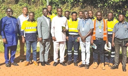 Wilbert Petty Brentum (3rd from left), Western North Regional Minister, and his team with some management and staff of the Ghana Bauxite Company