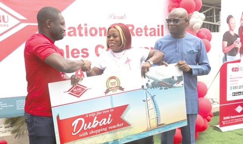Matthieu Nkatah (left), acting Managing Director, and CEO, SUNU Assurances Ghana Limited presenting a dummy cheque to Mercy Otabil (2nd from right), Overall Best Agent. With them is Paa Kwesi Eduafo Yankey (right), Board Chairman, SUNU Assurances Ghana LTD. Picture: SAMUEL TEI ADANO