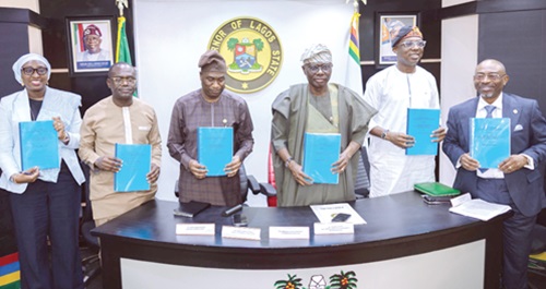 Joseph Siaw Agyepong (2nd from left), Executive Chairman, JGC, alongside the Governor of Lagos State and top officials displaying the signed Waste Management and Processing Concession Agreement between Zoomlion and Lagos State