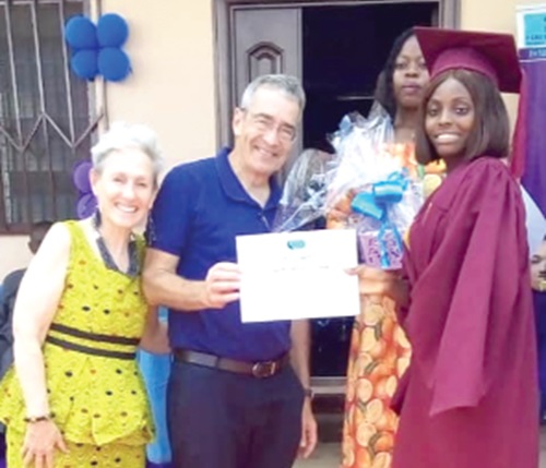 Roey Gilad (left), Israeli Ambassador to Ghana, presenting the overall best graduate prize to Hannah Abena Blessing Nyame