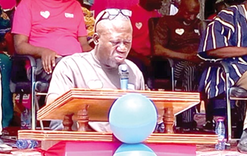 Rev. Ibrahim Sebiyam (inset), the Headmaster of the school, speaking at the event