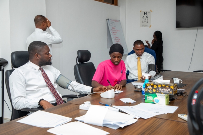 Some employees of the Banking checking their vitals at the screening centre at the Bank’s Head Office. 