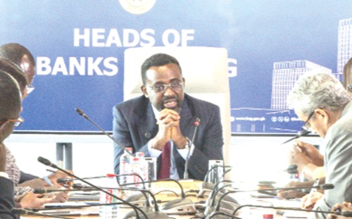 Dr Johnson Pandit Asiama (head of table), Governor, Bank of Ghana, addressing the bank officials in the meeting
