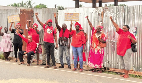 Some of the protesters in front of the project site. INSET: The power transformer beside the project site