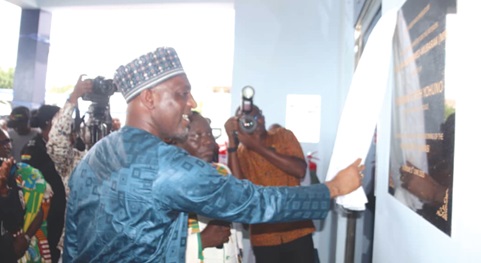 The new police hospital. INSET: Mohammed-Mubarak Muntaka, Minister for the Interior, unveiling the plaque to inaugurate the second police hospital in Kumasi
