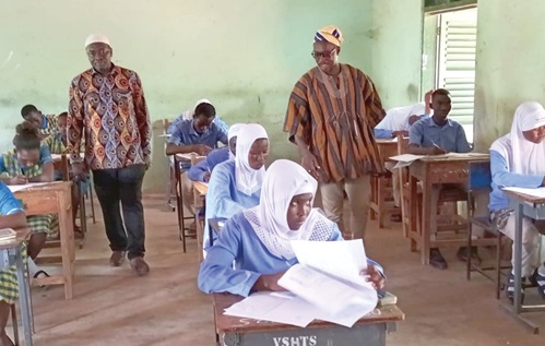 Dr Issahaque Munawaru (left),  Deputy Director General, Quality, and Access at GES, and Alhassan Alidu Jnr (right) monitoring the ongoing examination 