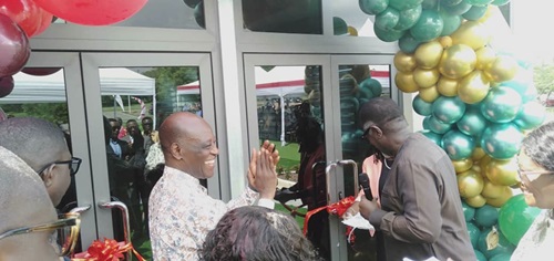 Rev. Dr Mensa Anamua Otabil (right), Chancellor of Central University, being assisted by Rev. Christopher Yaw Annor, Senior Pastor, ICGC Holy Ghost Temple, to cut the ribbon to inaugurate the Central University Hospital at the Miotso Campus