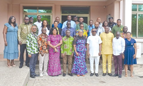 Rita Akosua Adjei Awatey (middle, front row), Eastern Regional Minister, and Abdul Noor Wahab (left), Director, Water Resources and Renewable Energy Department, VRA, with participants after the meeting