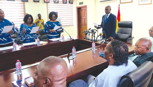 Haruna Iddrisu (right), Minister of Education, swearing in Council of the Chartered Institute of Human Resource Management, Ghana
