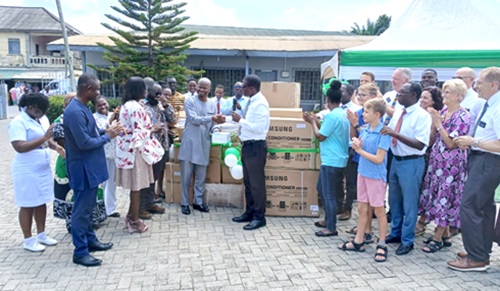 Desmond Anom Osei (right), President of the Koforidua Stake of Jesus Christ of Latter Day Saints, making a symbolic presention of the equipment to Dr Samuel Bortier Borlabi, Deputy Director in charge of Clinical Care at the Eastern Regional Health Directorate in Koforidua