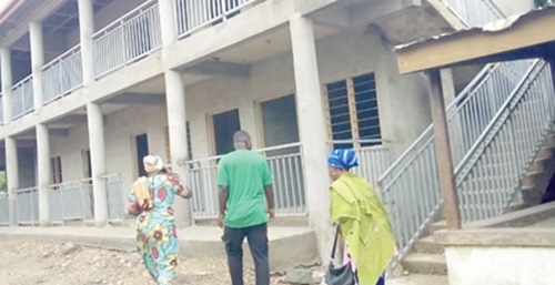 Manye Maku I (left),  Manya Krobo Divisional Queenmother, leading some visitors round the project