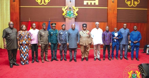 President Mahama (middle) in the company of Muntaka Mohammed Mubarak (5th from right), Minister for the Interior, and  Kwabena Mintah Akandoh (4th from right), Minister of Health, with heads of the Security Agencies and other officials after the presentation