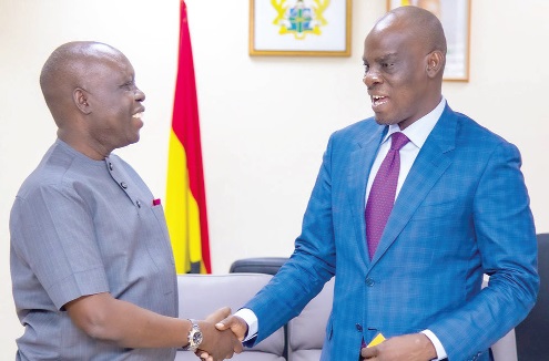 Haruna Iddrisu (right), Education Minister, welcoming Dr Wilfred Ochan, Country Representative of United Nations Population Fund in Ghana