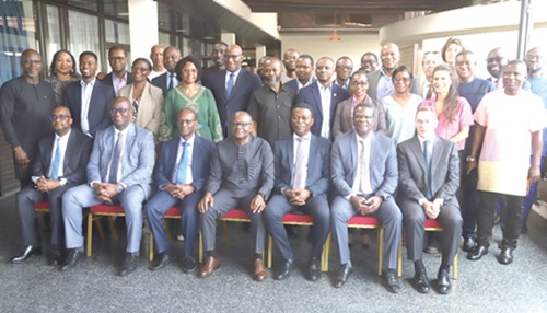 Solomon Adjetey Sowah (seated middle), Chief Director, Ministry of Energy, with Mark Awuah Baah (seated 3rd from right), Chief Executive Officer, GRIDCo, and members of the West African Power Pool Ministerial Committee of the Ghana Cote d'Ivoire Interconnection Reinforcement Project in Accra. Picture: SAMUEL TEI ADANO