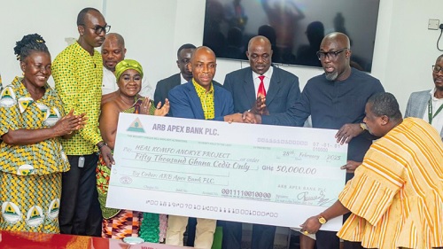 Ben Kwakye Adeefe (3rd from right), Ashanti Regional Chapter President of the Association of Rural Banks, and Maximus Attah (4th from left), Head of Corporate Affairs of ARB Apex Bank PLC, and some members of the association, presenting a dummy cheque to Prof. Otchere Addai Mensah (2nd from right), 