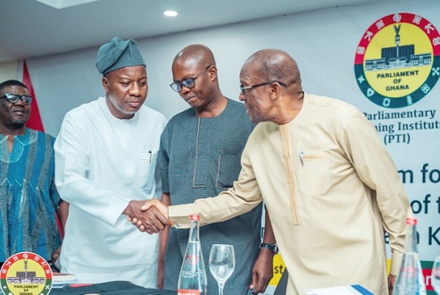  Alban Bagbin (right), Speaker of Parliament, exchanging pleasantries with Mahama Ayariga, Majority Leader of Parliament. With them are Bernard Ahiafor (2nd from right), First Deputy Speaker, and Rockson-Nelson Dafeamekpor (left), Majority Chief Whip