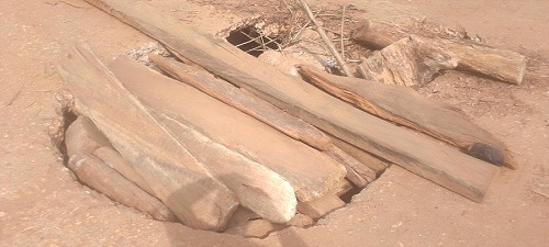 Portions of the bridge have developed holes, and have been patched with wooden slabs
