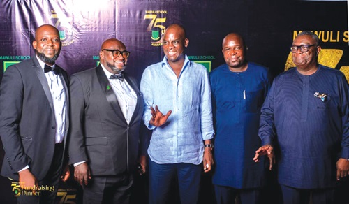Haruna Iddrisu (midde), Minister of Education, with some executives of the Old Mawuli Student Union after the Mawuli School’s 75th anniversary fundraising dinner