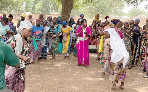 The indigenes performing a cultural dance The indigenes performing a cultural dance