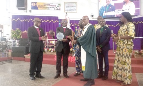 Rt Rev. Dr William Mpere Gyekye (2nd from left), Administrative Bishop of the church, presenting a memento to Emmanuel Nii Laryea, First Lay Chairman of the Tema Diocese. With them are Rt Rev. Samuel Ofori Akyea (left), Bishop of the Tema Diocese of the Methodist Church Ghana, and Gladys Entsuah (right), a Steward of the Bethel Methodist Church, Tema Community 8