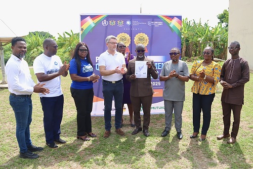Dr Eric Asuman (4th from right), Director-General, Ghana Meteorological Agency, displaying the certificate. With him are Dean Moriarty (4th from left), Consultant and External Auditor, TCG-UK, and Directors from the Ghana Meteorological Agency. Picture: ELVIS NII NOI DOWUONA 
