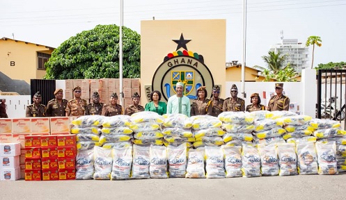 Muntaka Mohammed-Mubrak  (7th from left), the Minister for the Interior, and Patience Baffoe-Bonnie (5th from right), Director-General of the Ghana Prisons Service, with some officers after presenting the food items