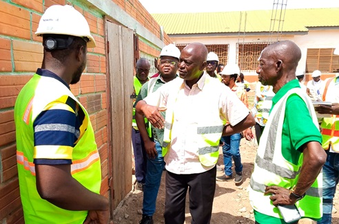 Professor Yaw Ofosu-Kusi (middle), the Board Chairperson of NADeF, interacting with some of the board members at Kenyasi