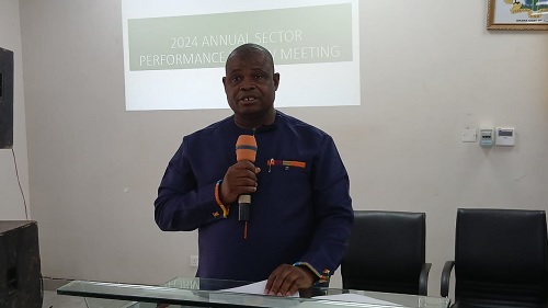  Dr Braimah Baba Abubakari, North East Regional Director of Health Services, addressing  participants in the meeting