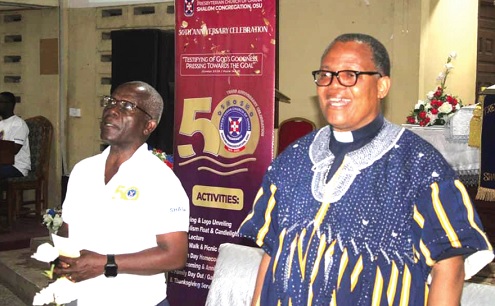 Rev. Erasmus Mensah Laryea (right), the Presbyterian District Minister for Osu, and Rev. Prof. Philipp Tetteh Laryea, the Guest Speaker, joyfully singing at the event. 