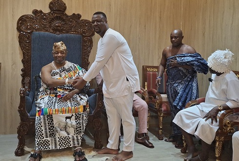 Nii Tachie Teiko Tsuru II, the Ga Mantse, exchanging pleasantries with Julius Neequaye Kotey, DVLA CEO, during the visit to his palace
