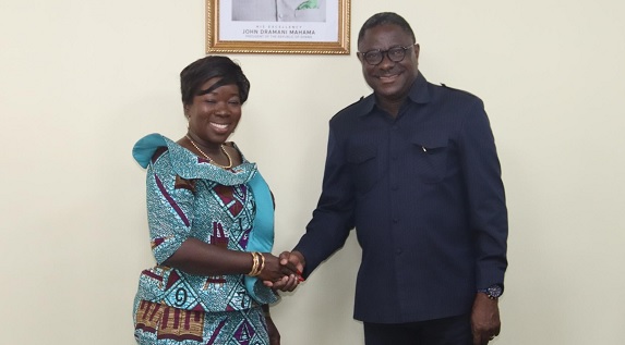 Elizabeth Ofosu-Adjare (left), Minister of Trade, Agribusiness and Industry, in a handshake with Dr Humphrey Kwesi Ayim-Darke (right), President, AGI