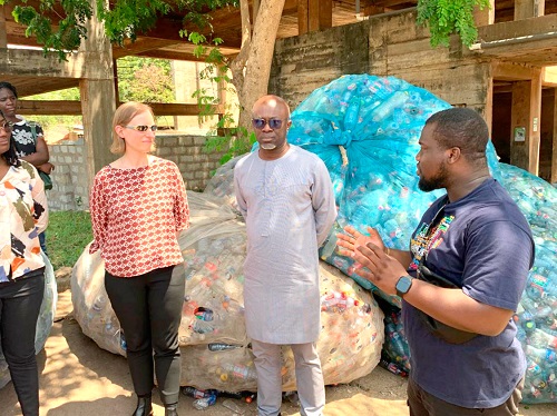 Jacob Johnson Attakpah (right), the Project Manager of Zero Waste Cities Project at GAYO, interacting with Desmond Appiah (middle), Country Director of Clean Air Fund, and Venetia Bell, the Chief Operating Officer of Clean Air Fund, during the tour of the facility