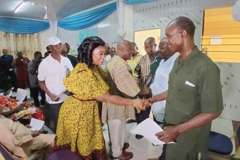 Rita Akosua Adjei Awatey (left), Eastern Regional Minister, shaking hands with the new executive in Koforidua