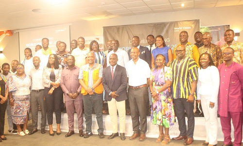 Ahmed Ibrahim (middle), Minister of Local Government, Chieftaincy and Religious Affiars; Jean-Claude Mukadi (5th from right), National Director, World Vision Ghana; Prof. Simon Mariwah (3rd from right), University of Cape Coast, with some participants in the ceremony.  Picture: ESTHER ADJORKOR ADJEI 