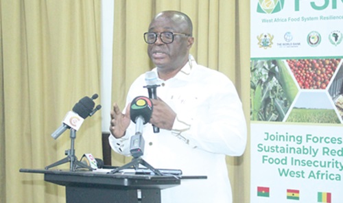 Michael a Owusu Agyeman (inset), Project Cordinator,  FSRP, delivering his address. Picture: ERNEST KODZI