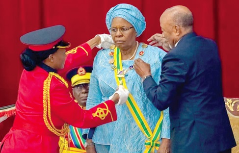 Nangolo Mbumba (right), former Namibian President, conferring the National Order of the Welwitschia Mirabilis on Nandi-Ndaitwah, the new Namibian President