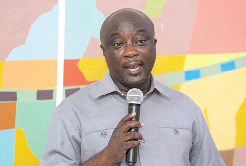 Divine Owusu-Ansah (inset), Director of Arts &amp; Culture at the Ministry of Tourism, Arts and Culture, addressing the audience at the event. Picture: CALEB VANDERPUYE 