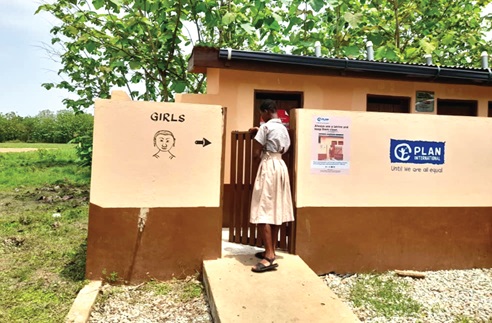 A female student of Atonkor MA JHS, entering a girl-friendly latrine provided by Plan International Ghana A female student of Atonkor MA JHS, entering a girl-friendly latrine provided by Plan International Ghana