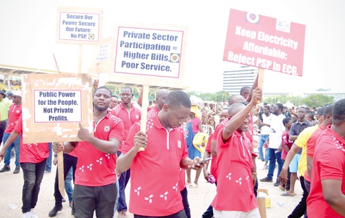 Some workers displaying their placards at the ceremony