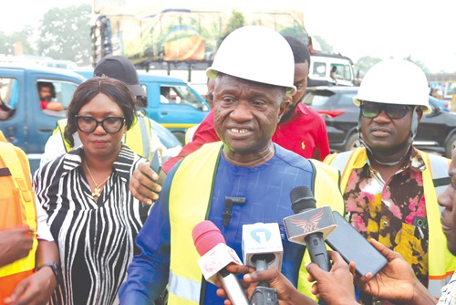  A section of the  ongoing Pokuase-Nsawam Highway project. INSET: Isaac Adjei Mensah, Chairperson, Parliamentary Select Committee on Roads and Transportation, speaking to journalists after the inspection. Picture: ELVIS NII NOI DOWUONA 