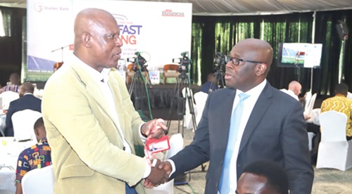  Ato Afful (left), Managing Director, Graphic Communications Group Ltd, interacting with Kwamina Asomaning, Chief Executive, Stanbic Bank Ghana, during the Graphic Business/Stanbic Bank breakfast meeting. Picture: ELVIS NII NOI DOWUONA 