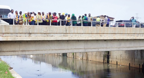 Members of the Parliamentary Select Committee on Works and Housing at the Odaw River project site