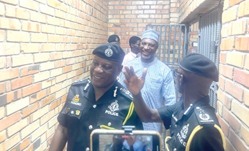 Christian Tetteh Yohuno (left), the Inspector General of Police, together with Alhaji Muntaka Mohammed-Mubarak (2nd from left), the Minister for the Interior, inspecting the police station (inset)