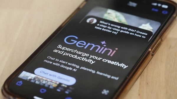 Google's Gemini AI chatbot shown on a phone in March 2024 in New York City. Google is now using a version of its Gemini AI model to fight scams on Chrome and Search. Michael M. Santiago/Getty Images/File