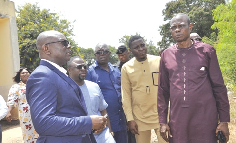 Benjamin Yawo Dei Headmaster of Mawuli School, interacting with some of the visiting MPs, while Francis Agbemadi (3rd from right), the Volta Regional Director of Education, looks on