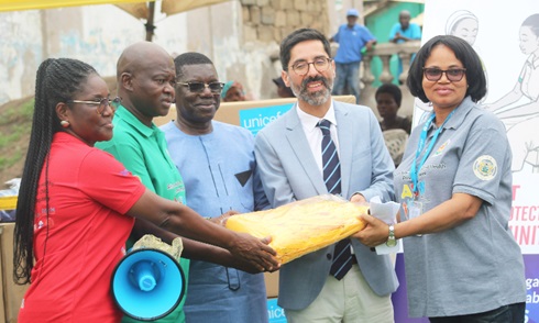 Dr Manuel Dewez (2nd from right), Chief of Health and Nutrition, UNICEF, and Charity Nikoi (right), SBC Specialist, UNICEF, presenting megaphones and aprons to Hafez Adams Taher (3rd from left), Ministry of Health representative; Prof. Samuel Kaba Akoriyea (2nd from left),  Director-General, Ghana Health Service (GHS), and Mabel Asafo (left), acting Director, Health Promotion Division, GHS, during the launch  Picture: ESTHER ADJORKOR ADJEI 